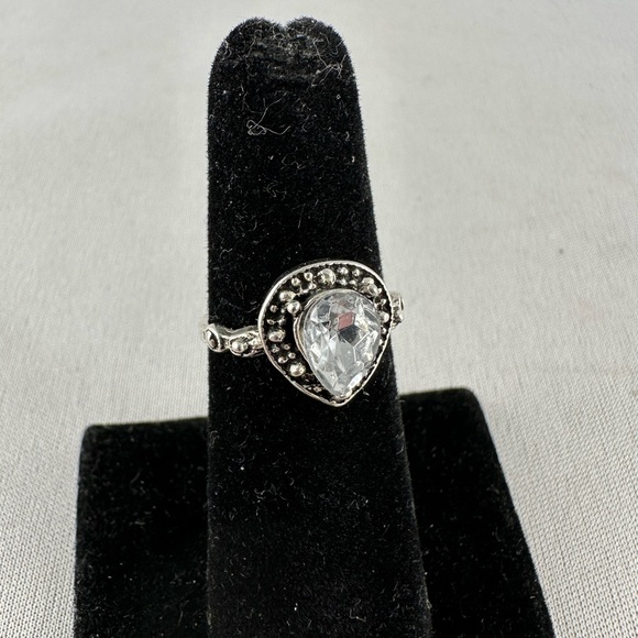 Jewelry - Silver tone ring with a clear teardrop shaped crystal center.